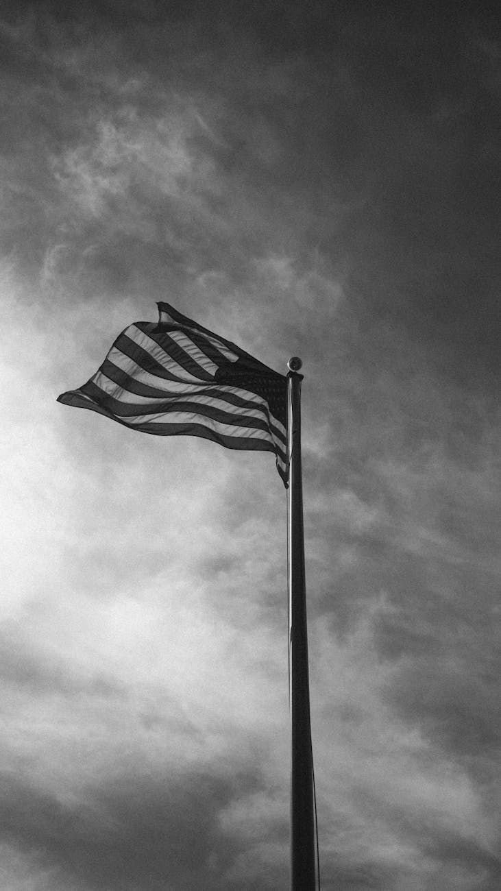 american flag against a dramatic sky